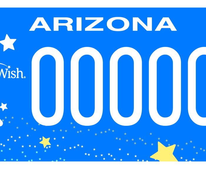 Arizona license plate with a blue background, yellow and white stars, Make-A-Wish logo, and large white numbers in the center.