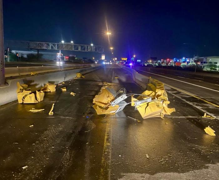 Crash debris on freeway of vehicle into attenuator