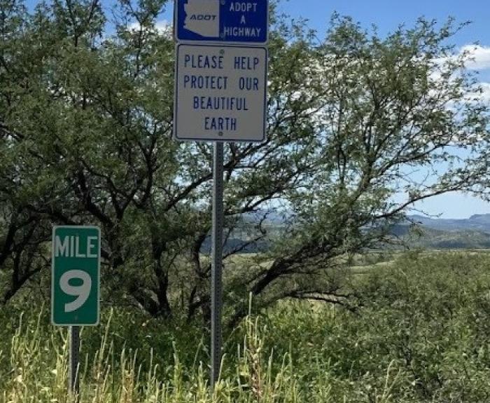 Volunteer sign please help protect our beautiful earth at mile 9