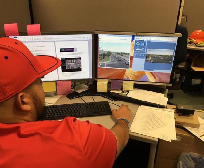 Operator monitors traffic signals remotely via computer