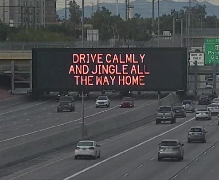 A digital message board on the highway encourages motorists to drive calmly.