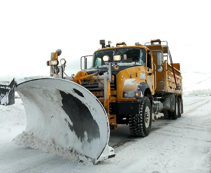 ADOT snowplow parked along highway