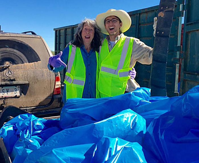 Two volunteers with trashbags