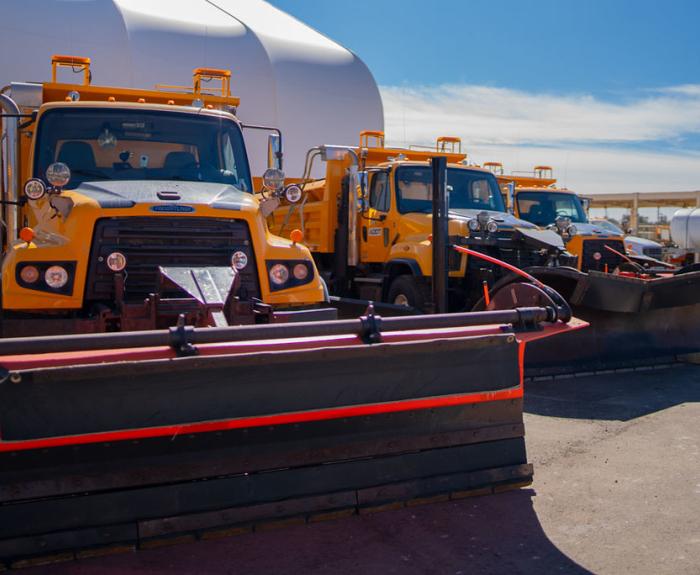 A line of snowplows outside. 
