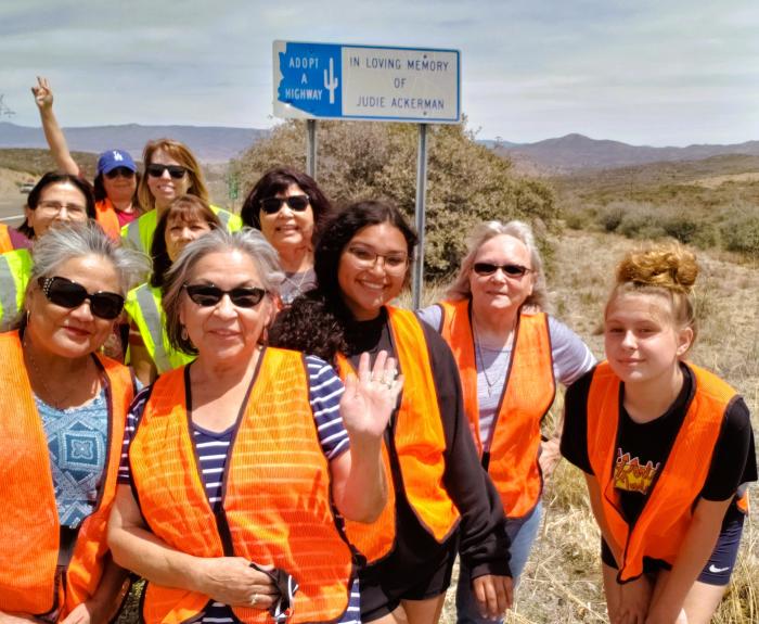Volunteers with Adopt a Highway sign for Judi Ackerman on SR 69