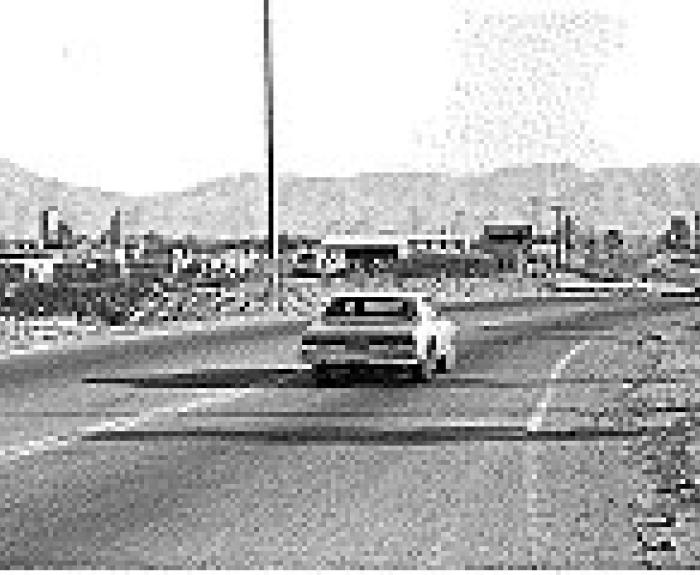 Dust storm showing car on road
