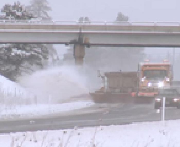 Image of snow plow on highway