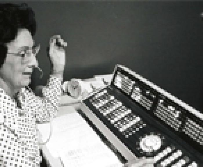 1970s photo of woman operating old phone system