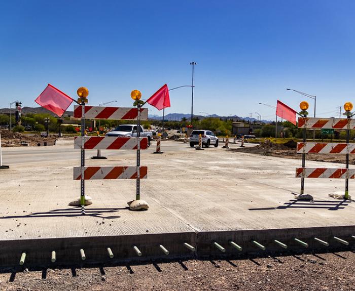Construction zone with barricades and flags