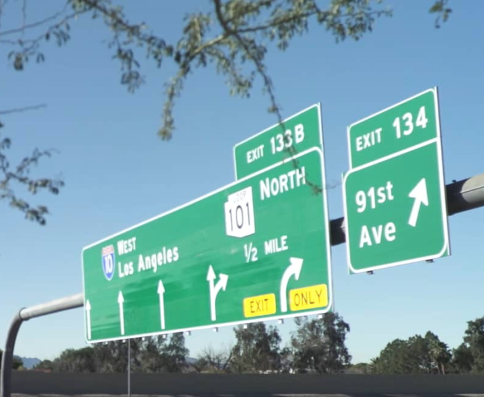 Overhead freeway sign showing I-10 west and 101 north