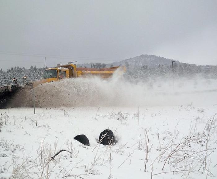 snowplow at work in the snow up north