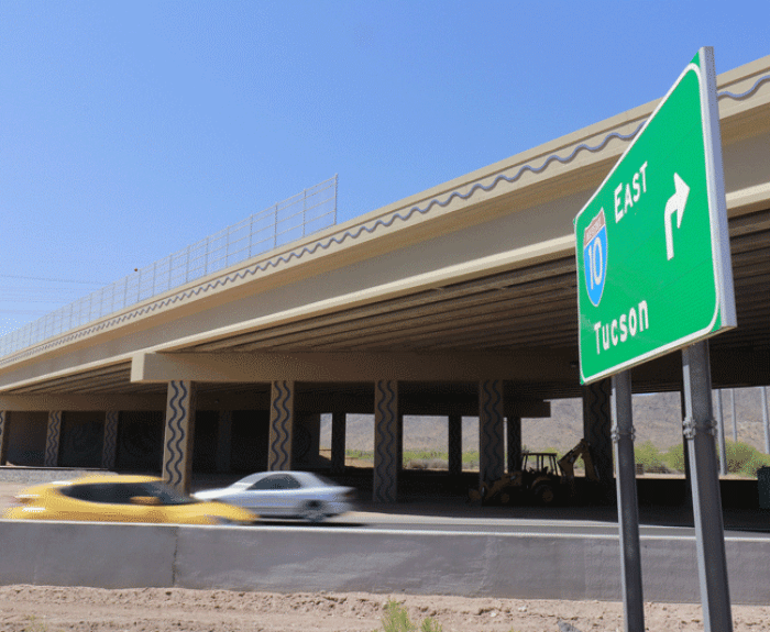 I-10 at Jimmie Kerr Blvd. overpass, car and green sign