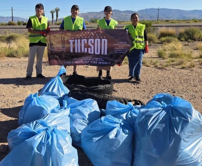 AAH four Tucson volunteers and bagged trash
