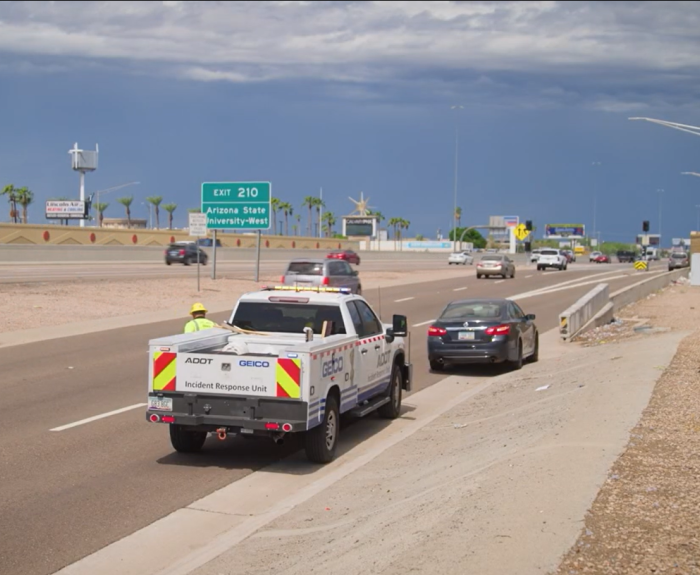 A first responder helping a stranded motorist