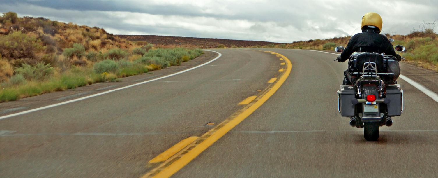 Image of a motorcycle rider on highwat