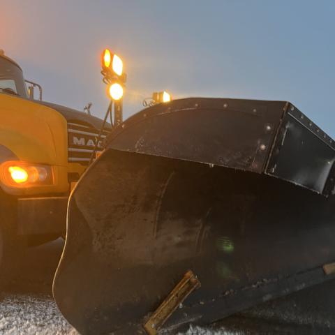 A snowplow blade with very little damage after being struck.