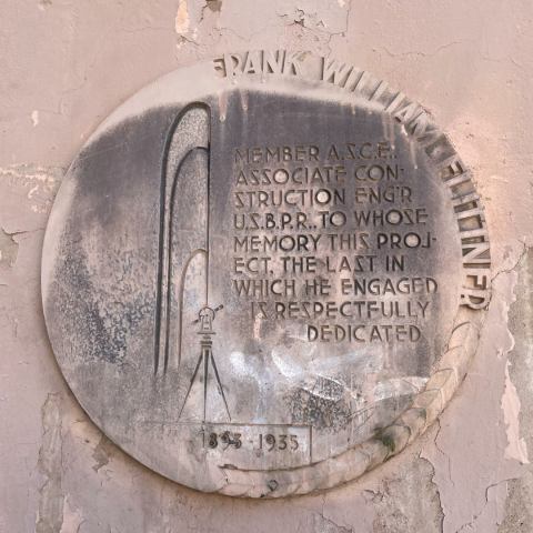 A plaque on a highway underpass dedicated to Frank Flittner.